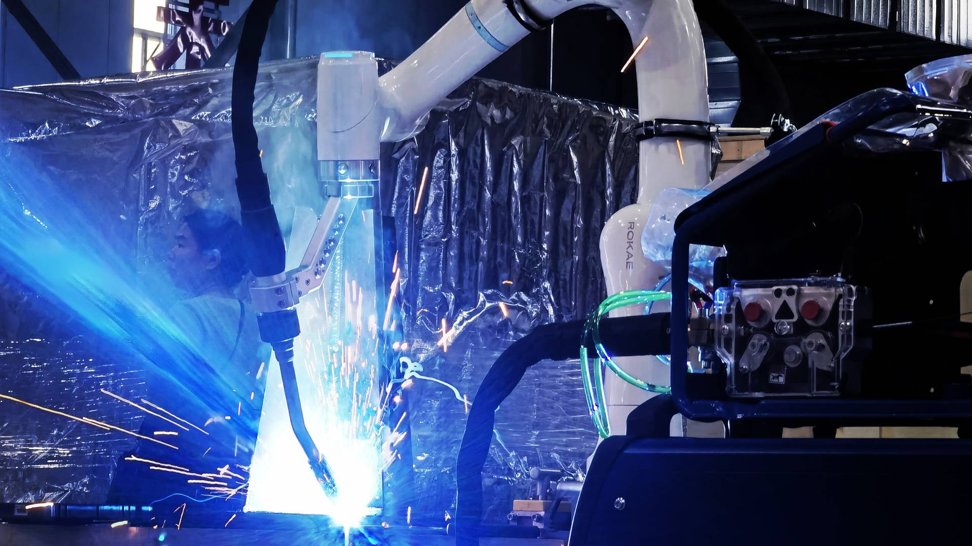 OpenMind推出硬件无关操作系统 让不同机器人可互相协作OpenMind推出硬件无关操作系统 让不同机器人可互相协作